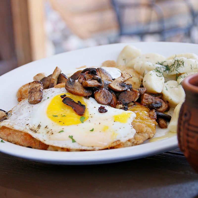 Authentic Polish veal topped with a sunny-side-up egg and sautéed mushrooms at U Gazdy Restaurant in Wood Dale, IL.
